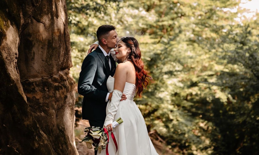 A couple embracing in a forest (stock photo)